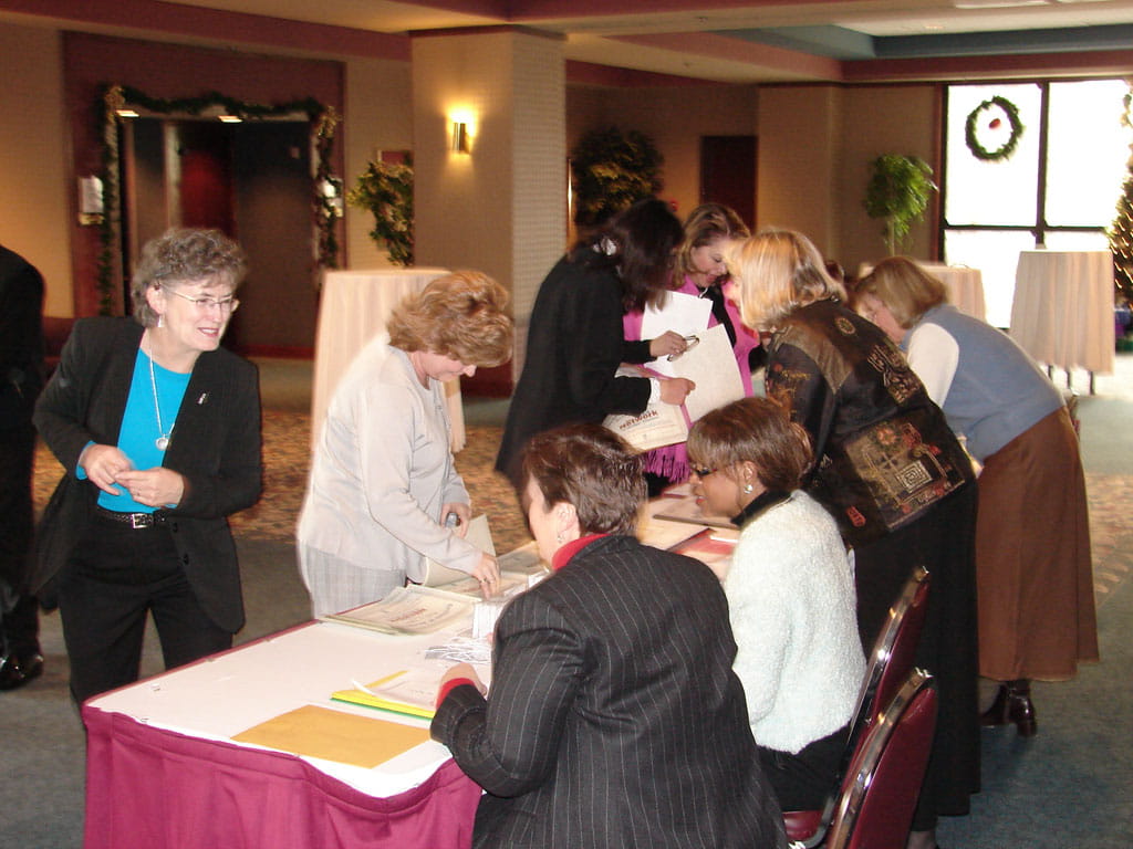 Network members arrive at the Connections for Action Conference, December 8, 2005