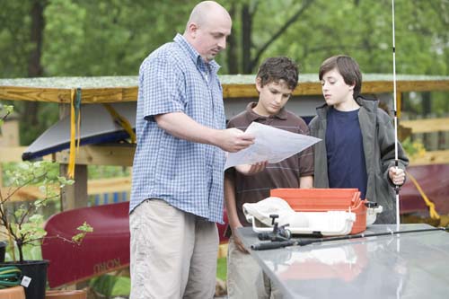 A father with his sons reviewing the Eat Safe Fish Guide before they go fishing A father with his sons reviewing the Eat Safe Fish Guide before they go fishing