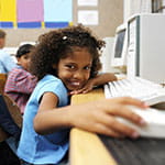 Child playing on a computer