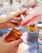 pharmacist filling pill bottle