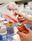 pharmacist counting pills