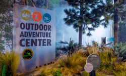 Outdoor Adventure Center logo on indoor sign Outdoor Adventure Center logo on indoor sign