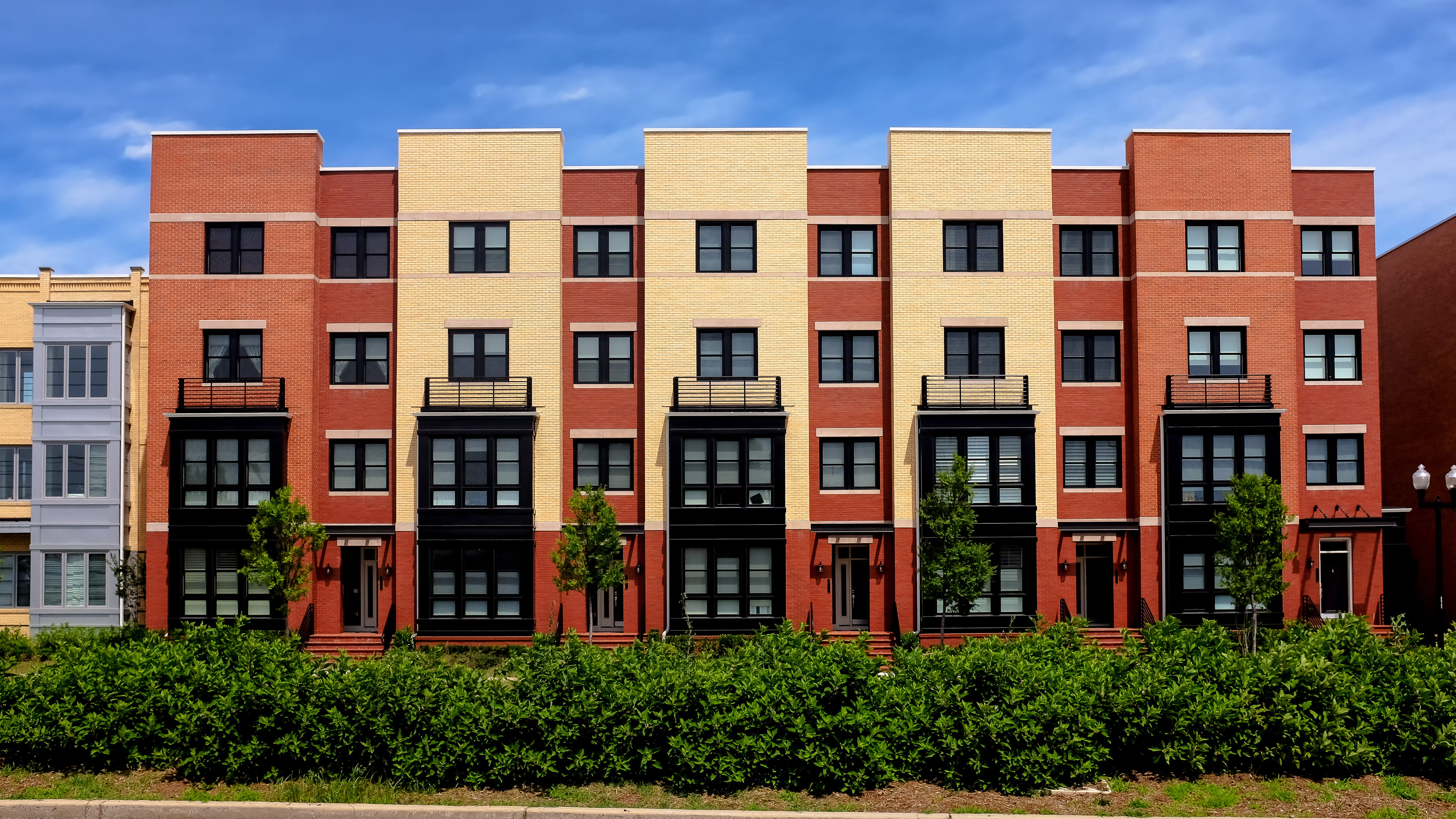Modern apartment buildings on a sunny day with a blue sky
