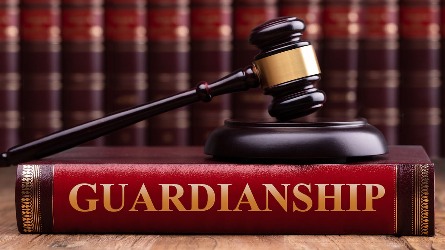 Gavel And Striking Block Over Guardianship Law Book