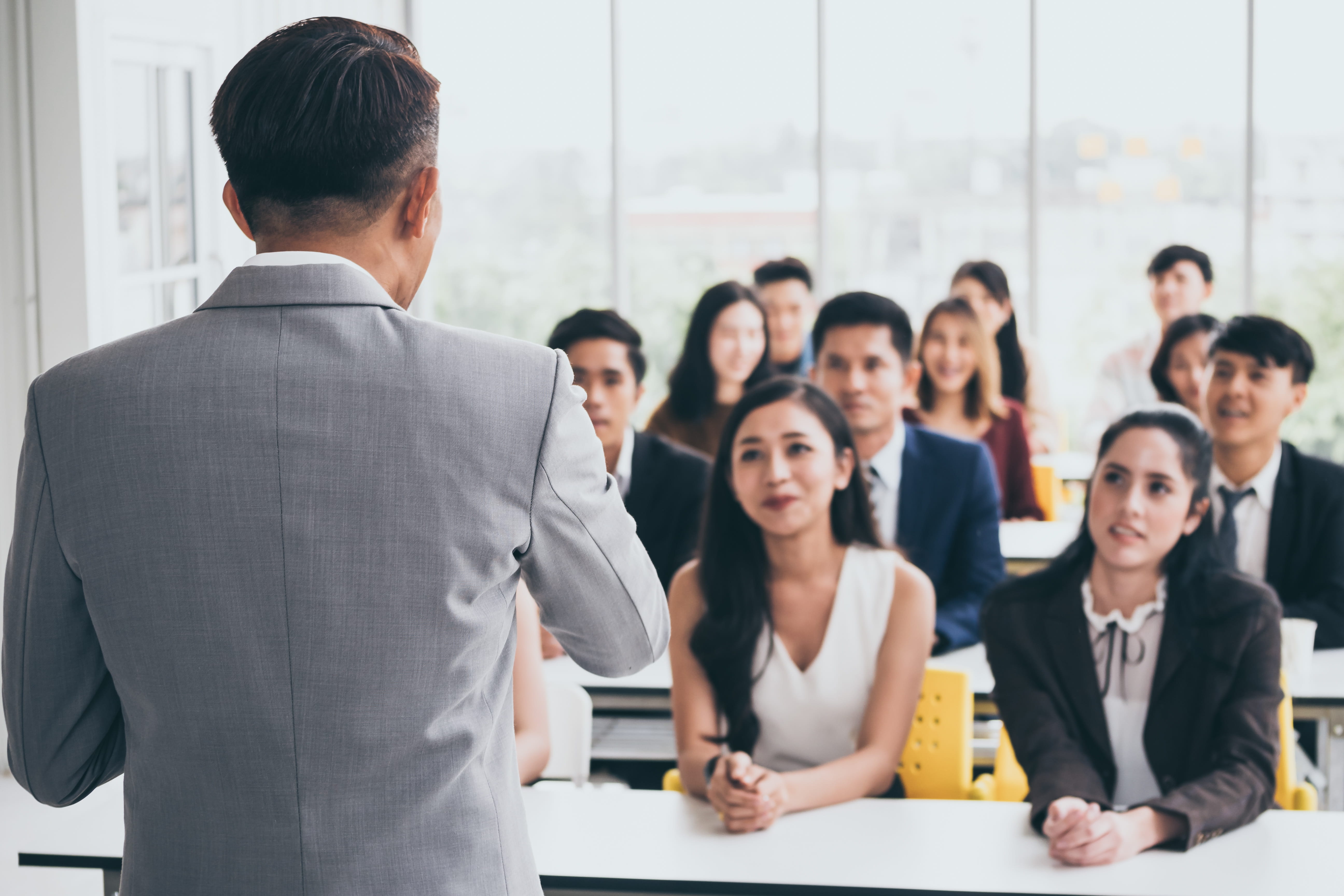 Businessman is explaining works to officers while training together at the office
