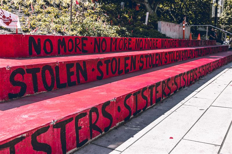A sign with text "No more stolen sisters" on the Robson Square. Memorial to honor Missing and Murdered Indigenous Women in US and Canada.