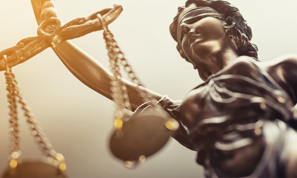 Lady Justice with scales in hand