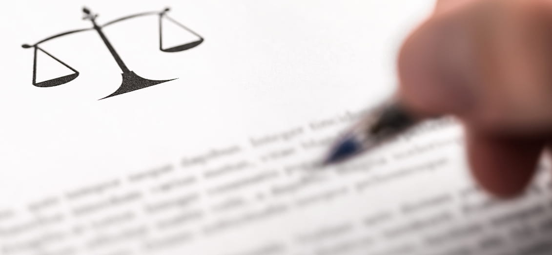 Man writing document with scale icon and sign with pen. 