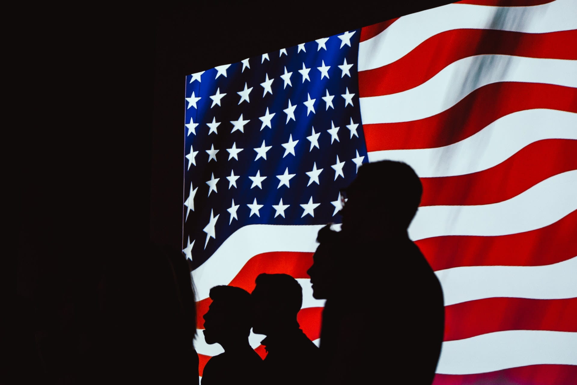 Servicemembers with the American flag