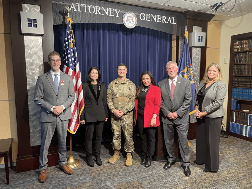 Group photo. From Left to Right: Major Gregory G. Justis, Attorney General Dana Nessel, Chief Deputy Fadwa Hammoud, Environmental and Government Operations Bureau Chief Peter Manning, and Environment, Natural Resources and Agriculture Division Chief Polly Synk.