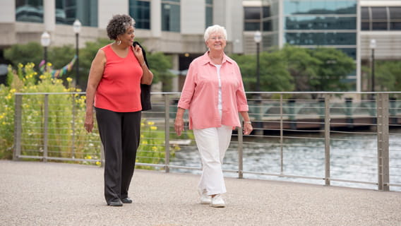 Two senior women walking
