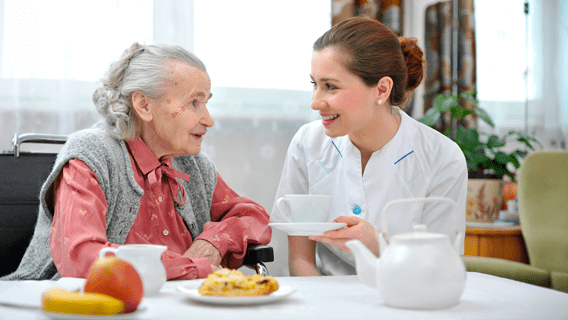 Older woman being served a meal