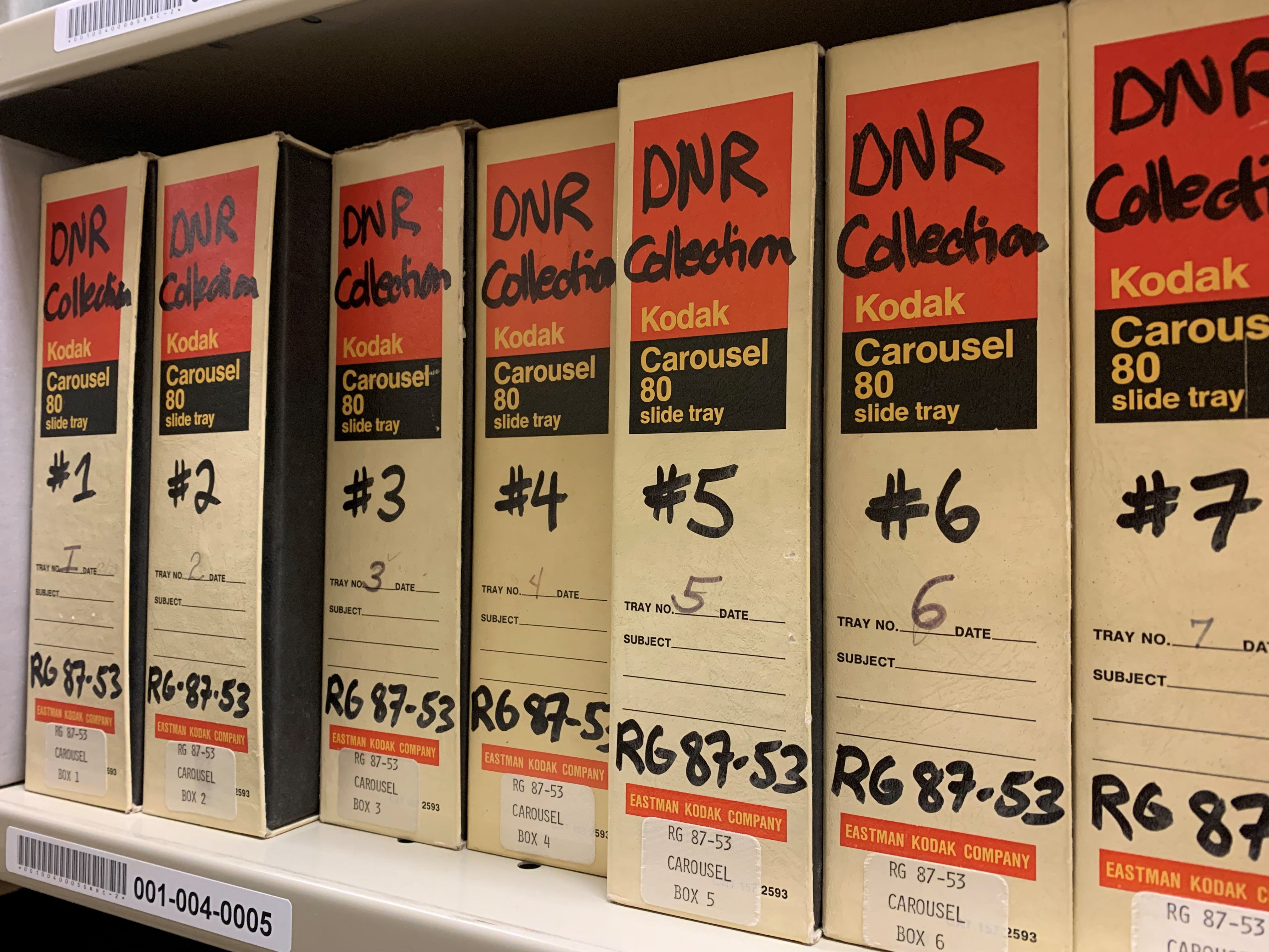 Kodak carousels of 80 slot slide trays on a shelf labeled "DNR Collection."