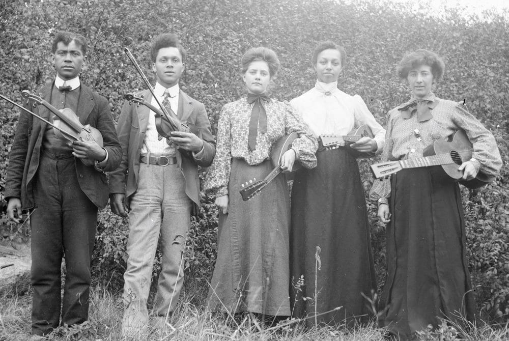 Five musicians photographed from early 1900s.