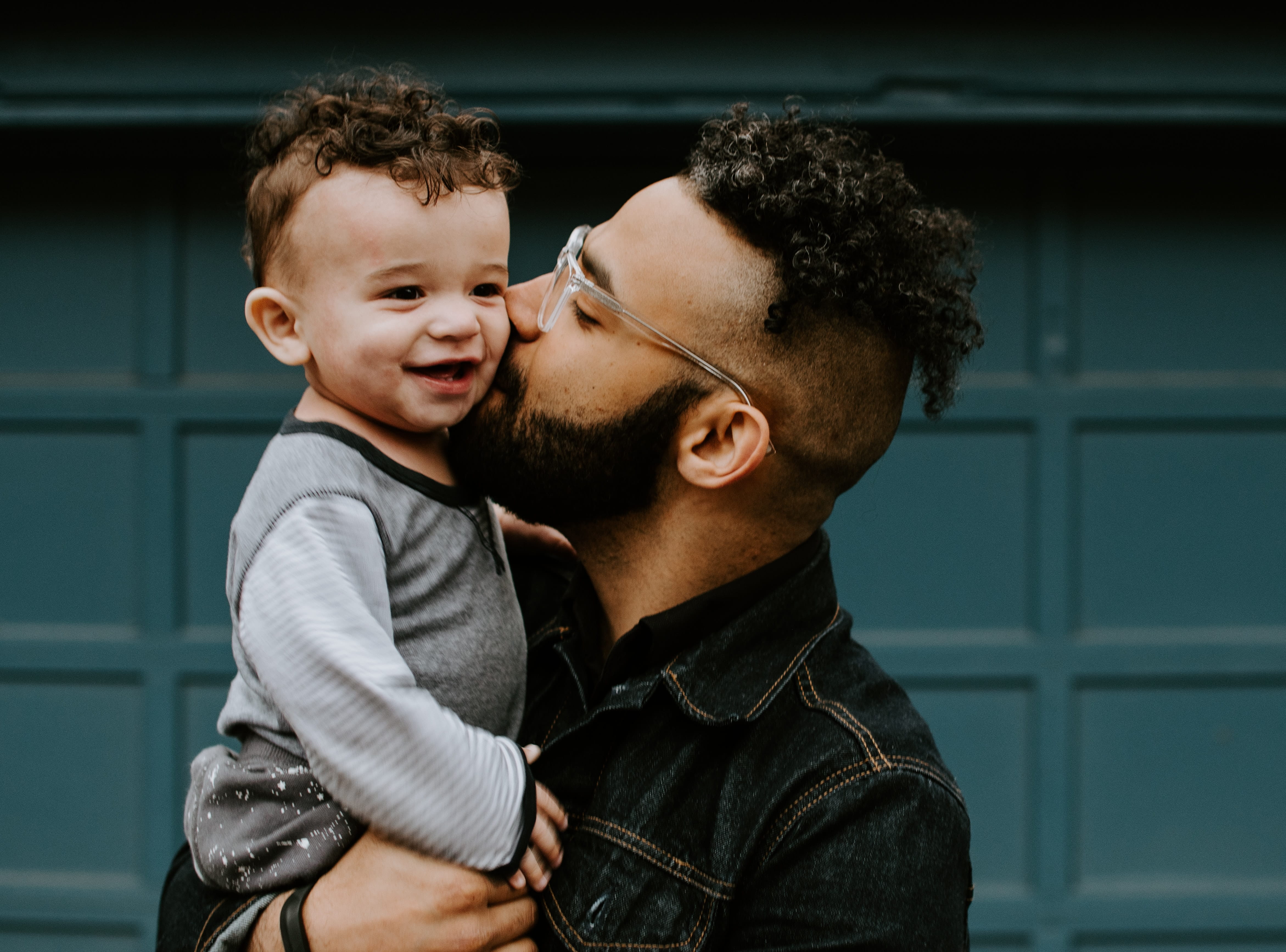 Photo of  a father holding his baby