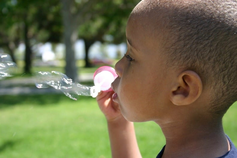 Child Blowing Bubbles