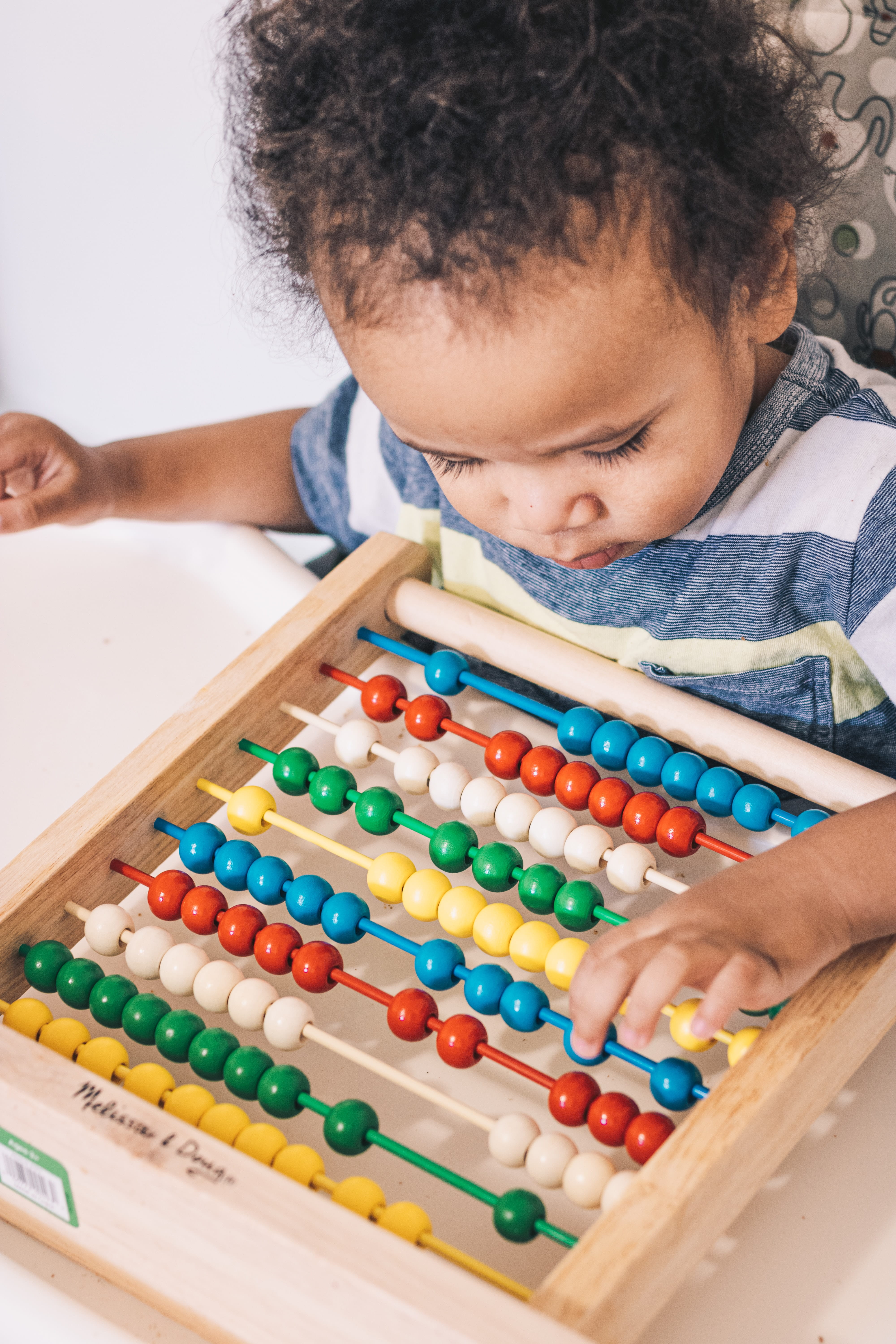 Photo of toddler playing with a toy