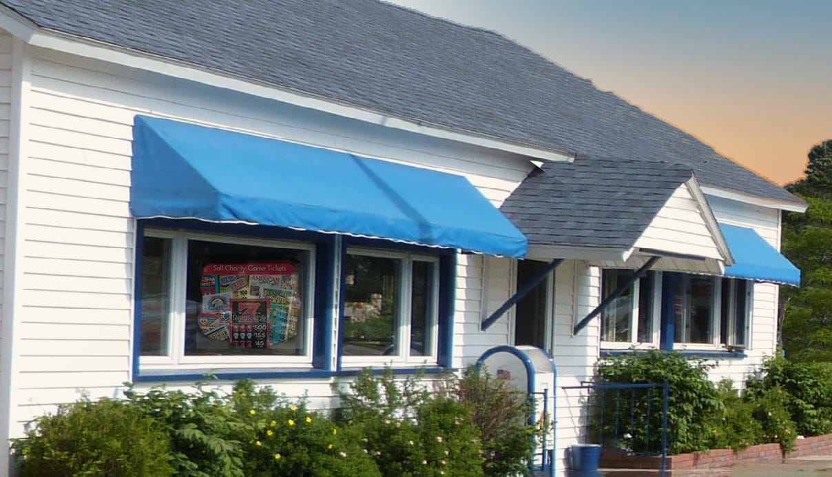 White building with blue accents an example of a building a club might sell charity game tickets in