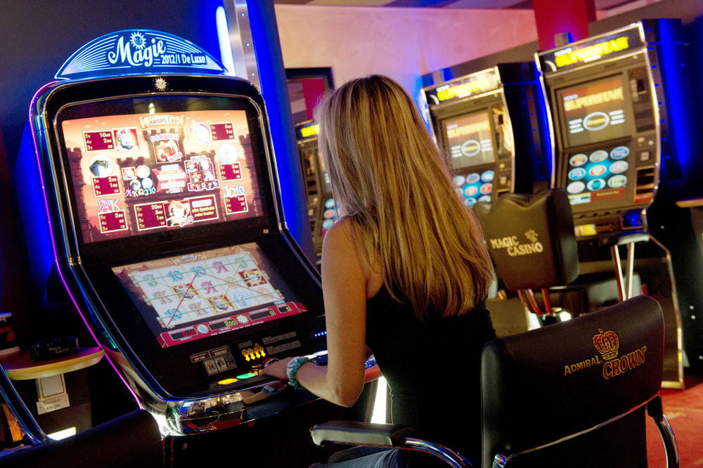 Woman gambling at a slot machine