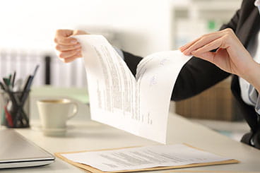 Businesswoman ripping up a contract