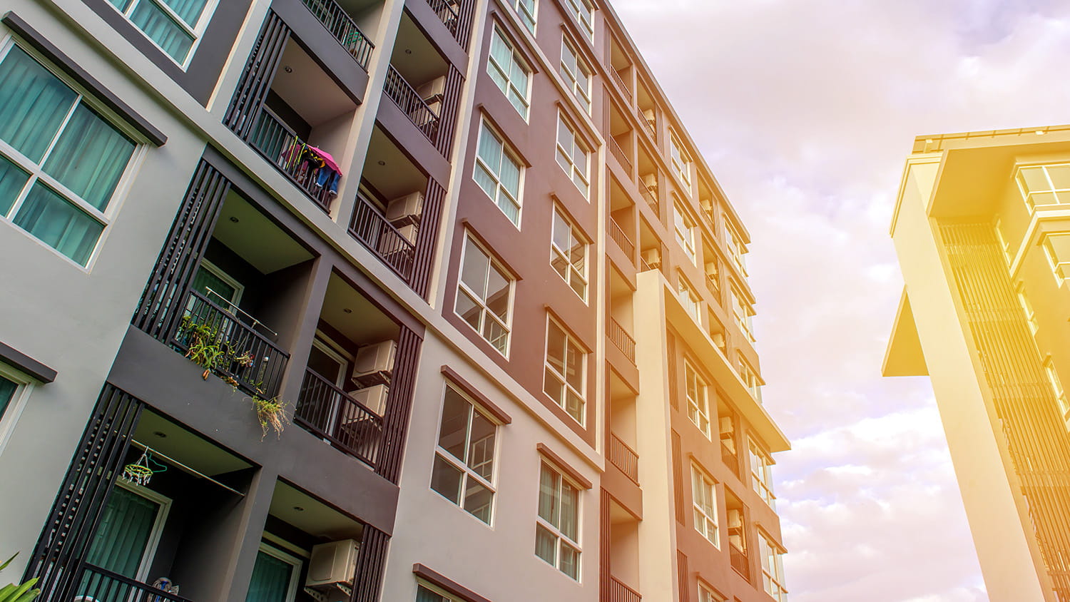 Exterior shot of a multi-story modern apartment building