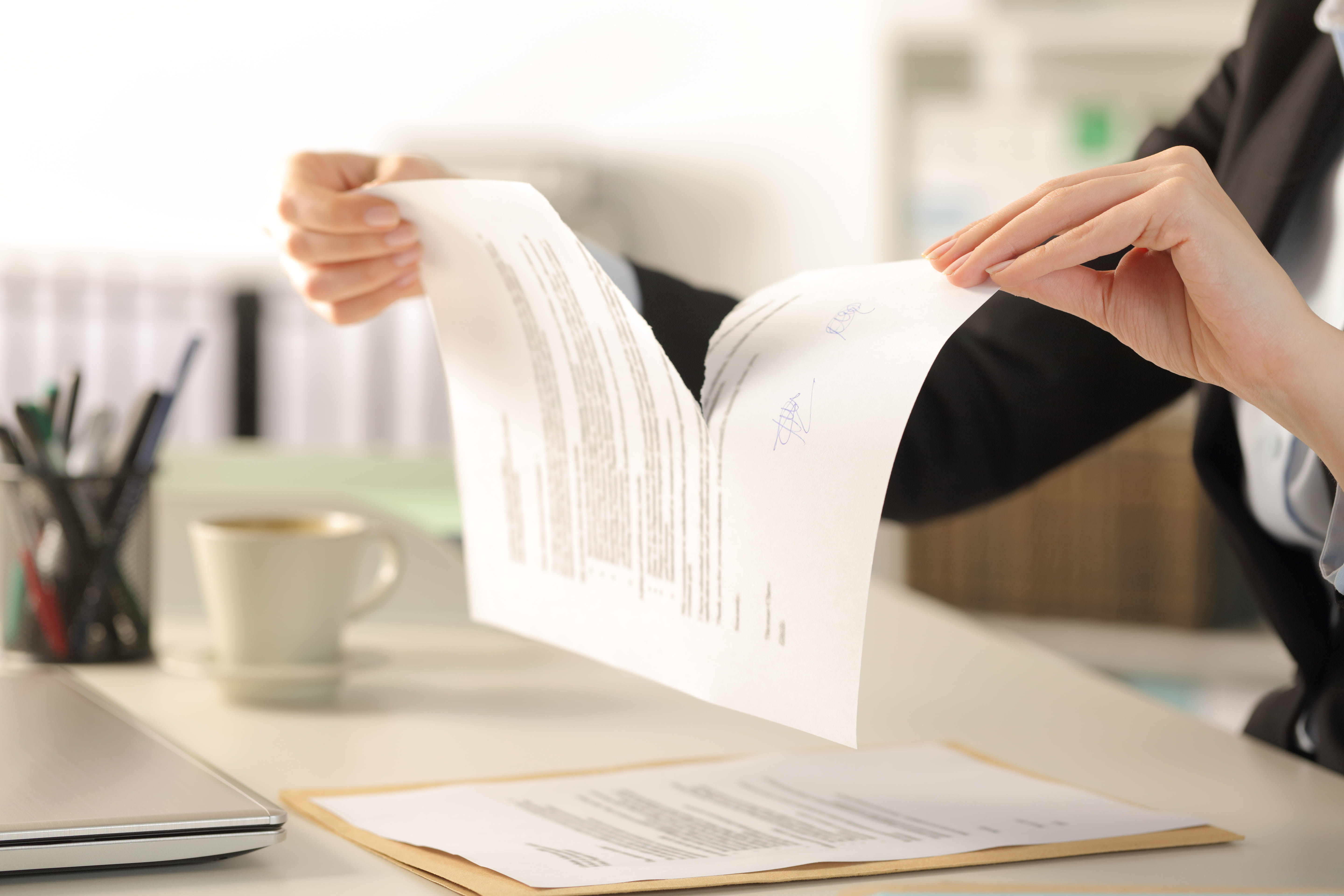Businesswoman ripping up contract