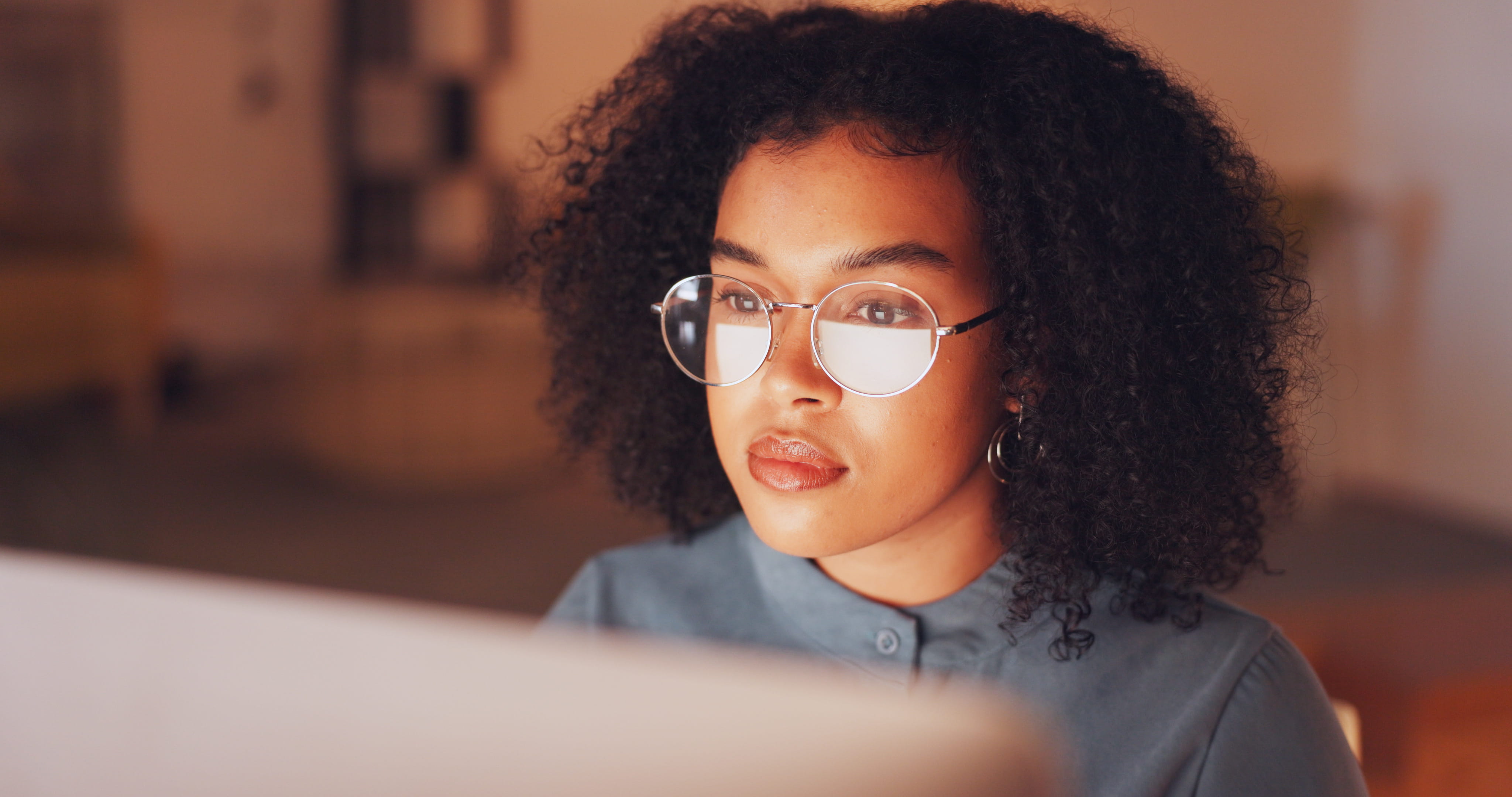 black woman and employee with glasses, night and online reading