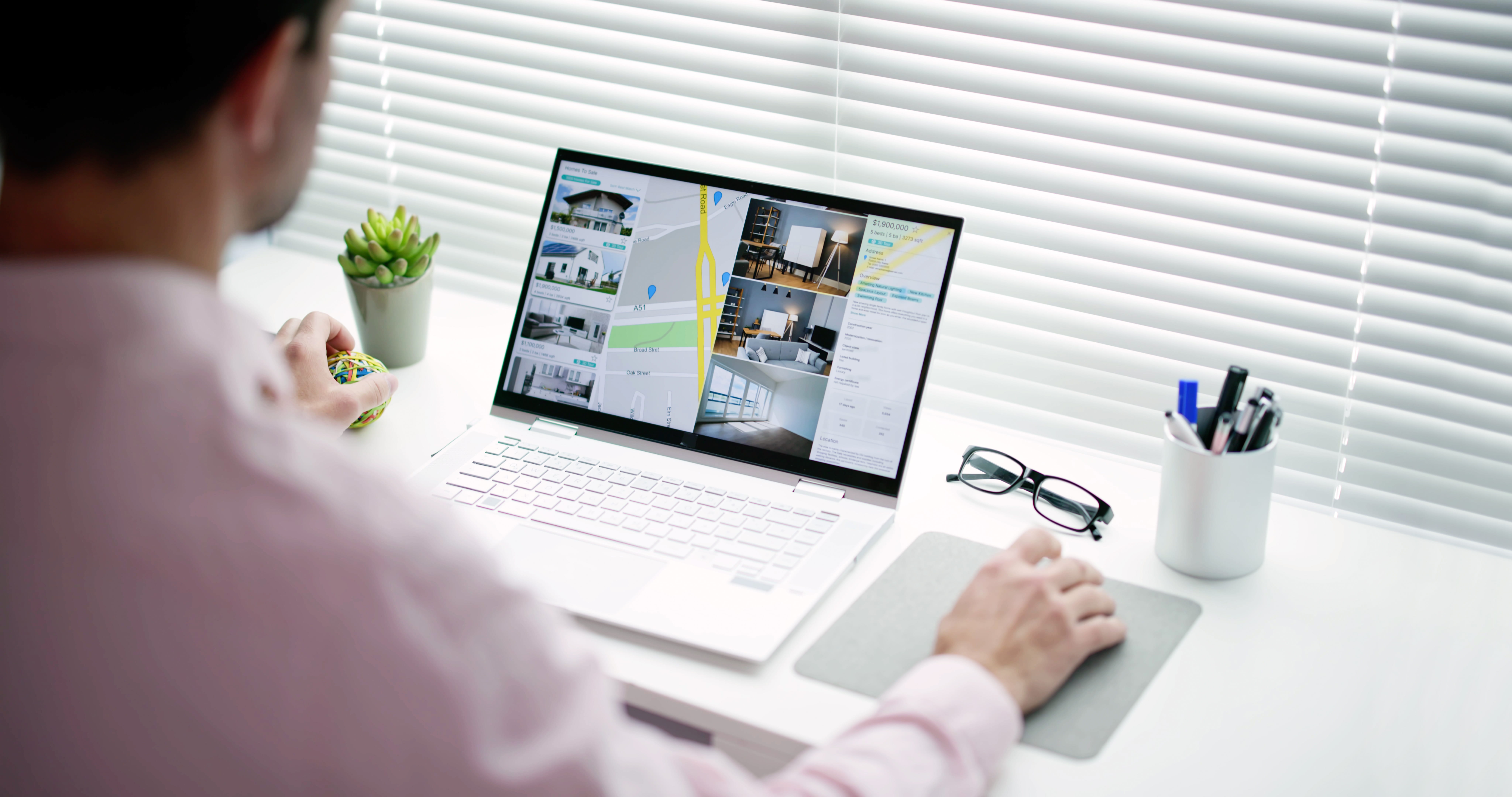 Man looking online for available rental units