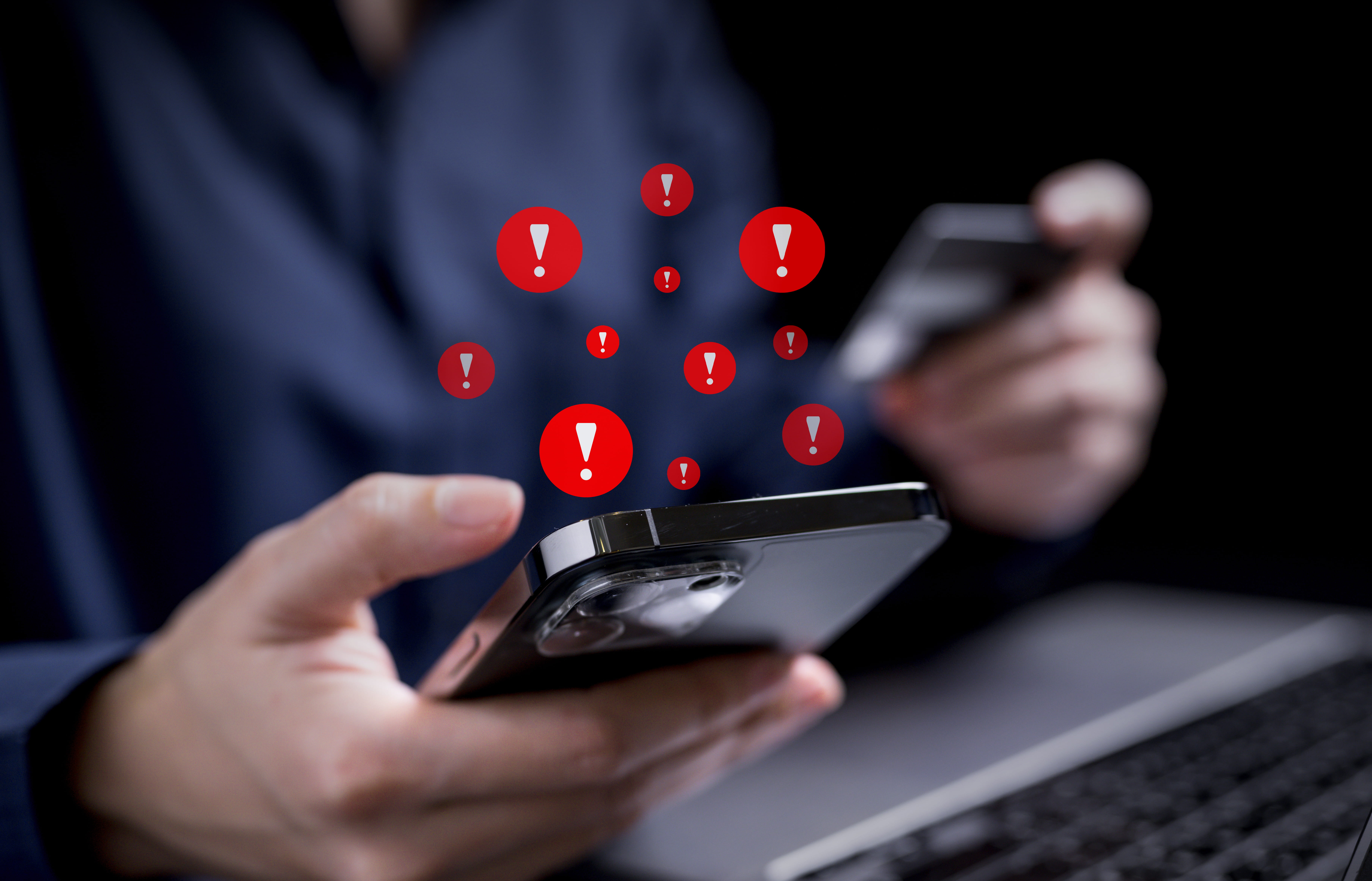 People with warning notification and spam message icon on mobile phone