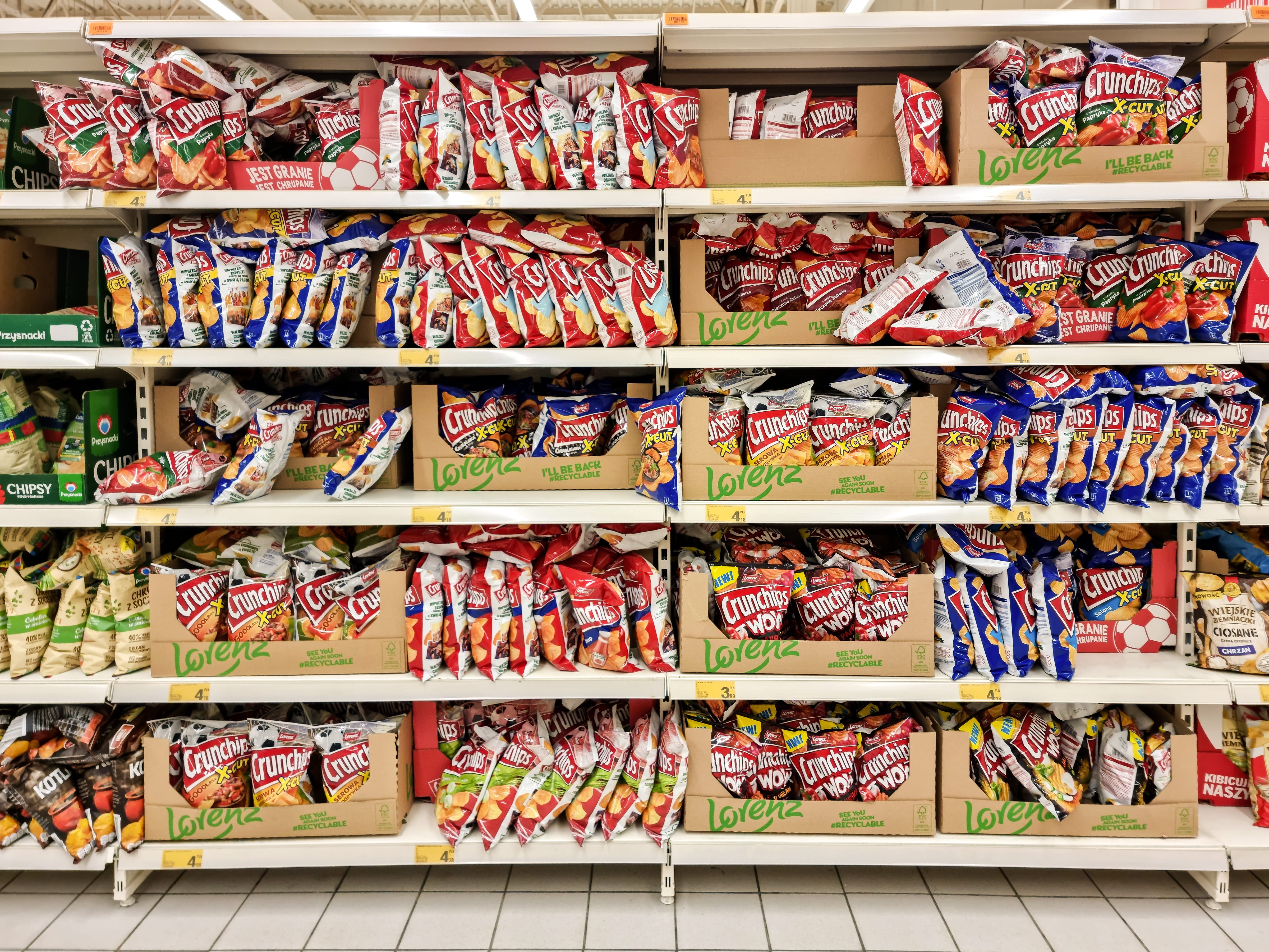 Crunchips flavored potato crisps packs in snacks alley, front view,