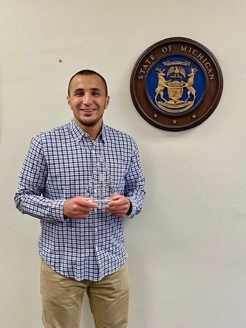 Image of Agent Ahmed Bazzi with his Agent of the Year Award