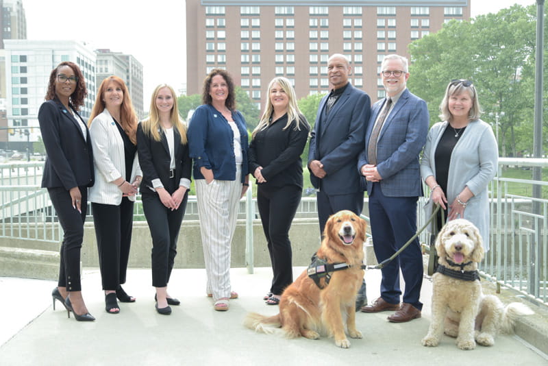 Group shot of MDOC's Wellness Unit and their service dogs.
