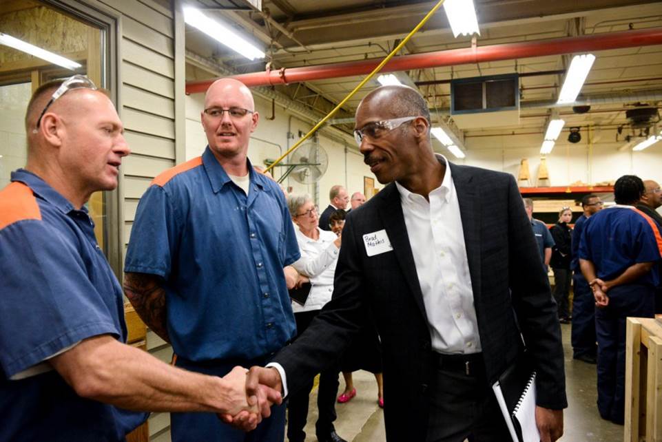 Image of two prisoners meeting with an employer