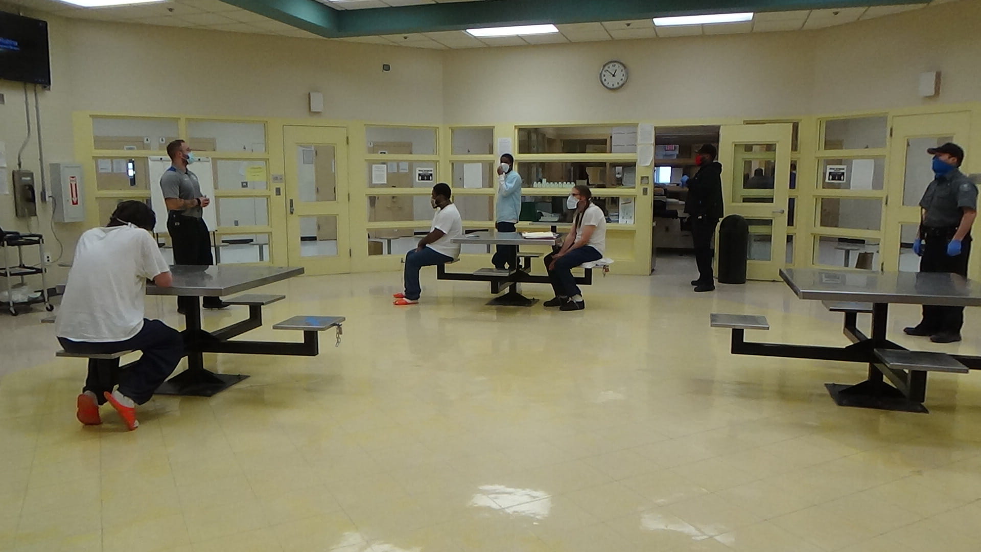 Prisoners participating in group therapy led by a Qualified Mental Health Professional 