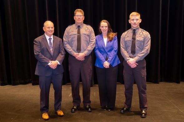 Left: John Davids (class namesake) with Officer Todd Bratt, MDOC Director Washington, and Officer Mason Bray
