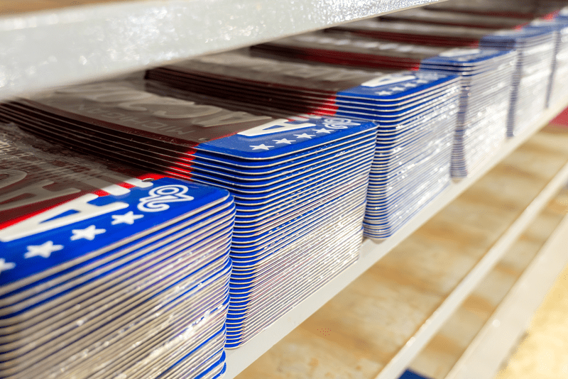 Several stacks of brand new Michigan license plates.