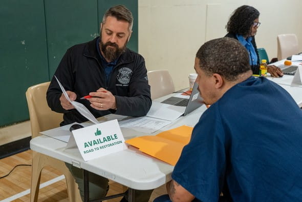 State official reviews driving record with Road to Restoration attendee