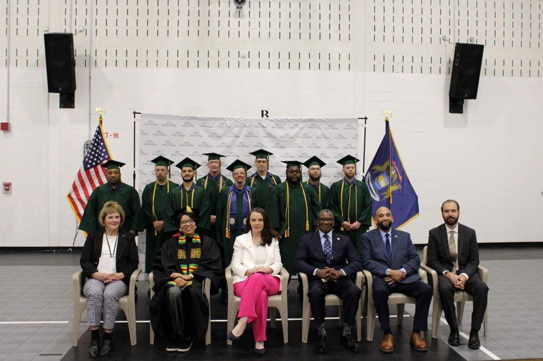 Group of people lined up for a photo together