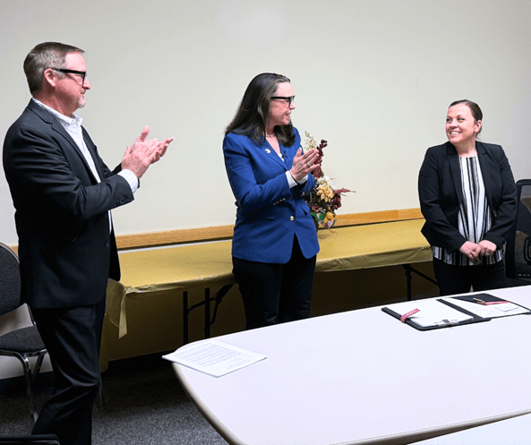 MDOC Director Heidi E. Washington (center) and Field Office Administrator Russ Marlan (left) applaud Agent of the Year Winner Mickaela McKeller (right).