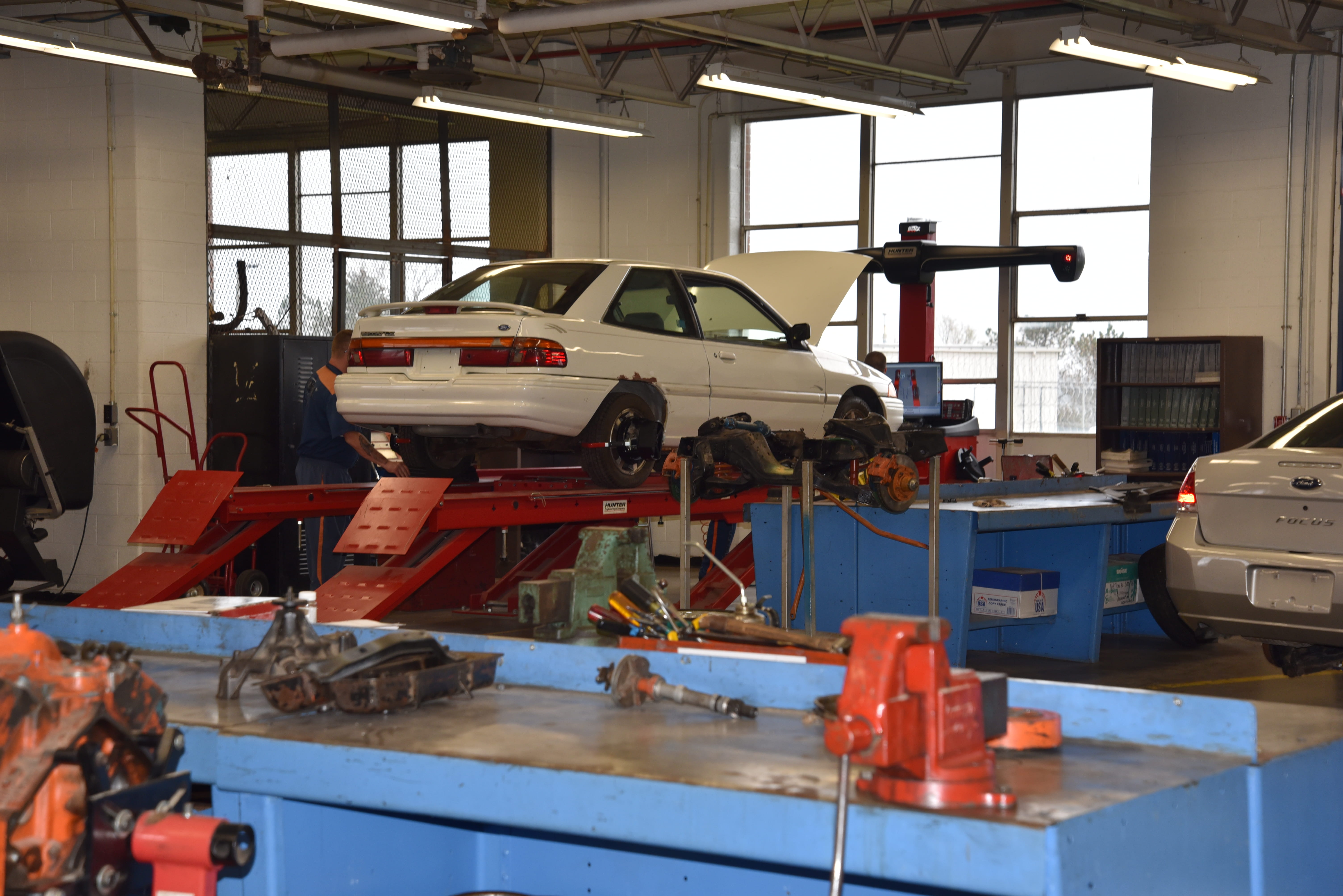 Photo of inside of auto mechanic garage at vocational village.