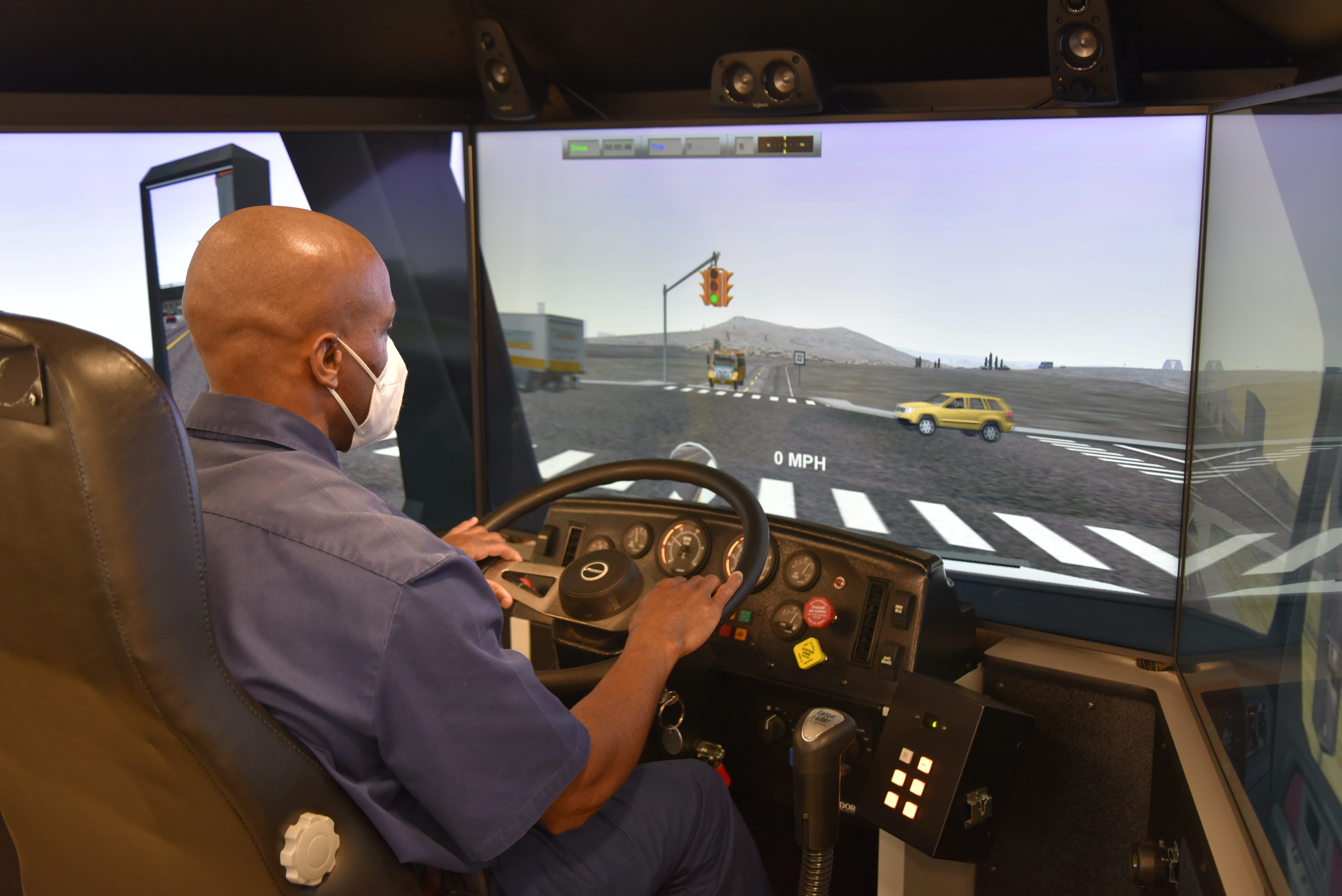 Photo of a prisoner in the truck simulator practicing.