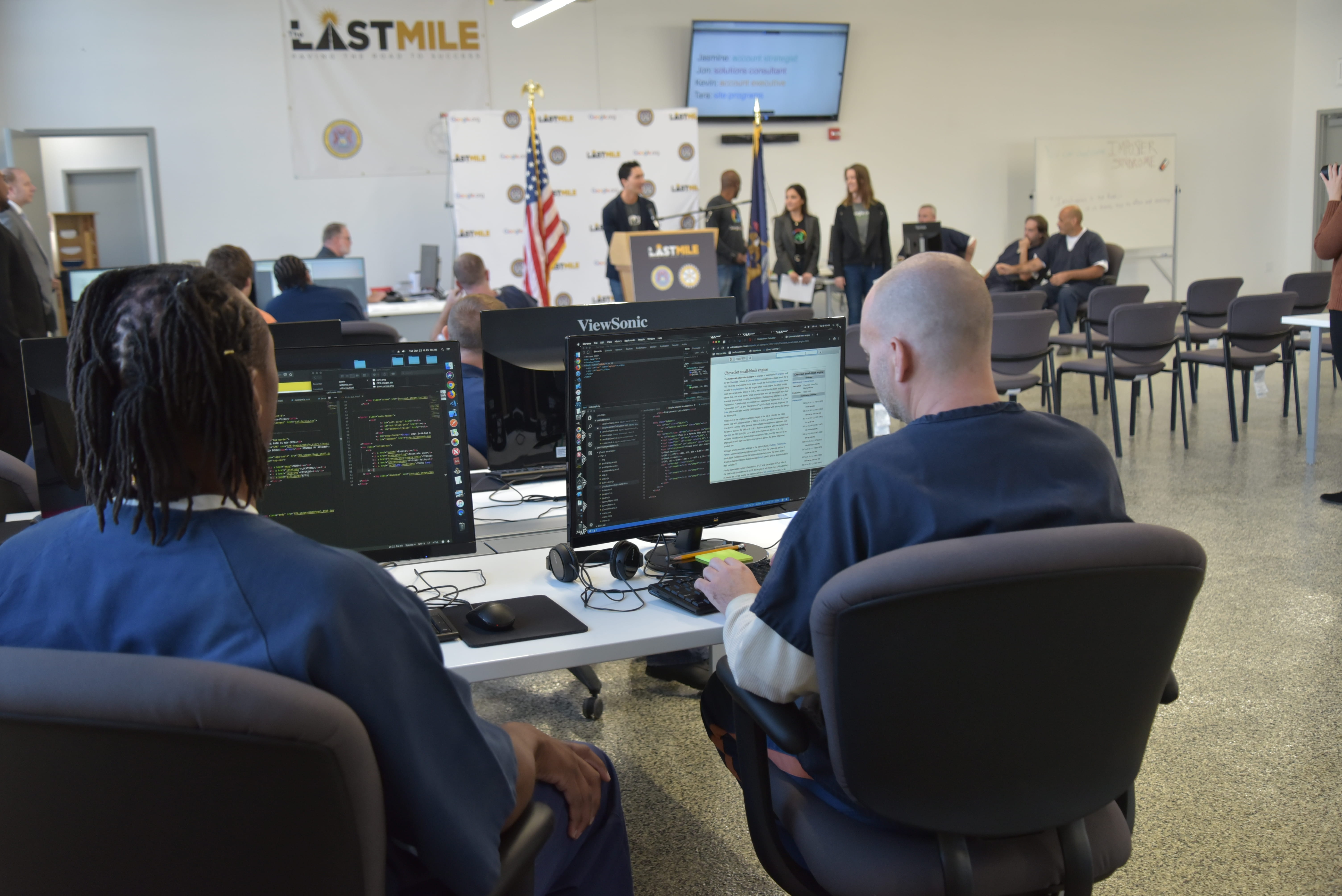 Photo of two prisoners in a computer class.