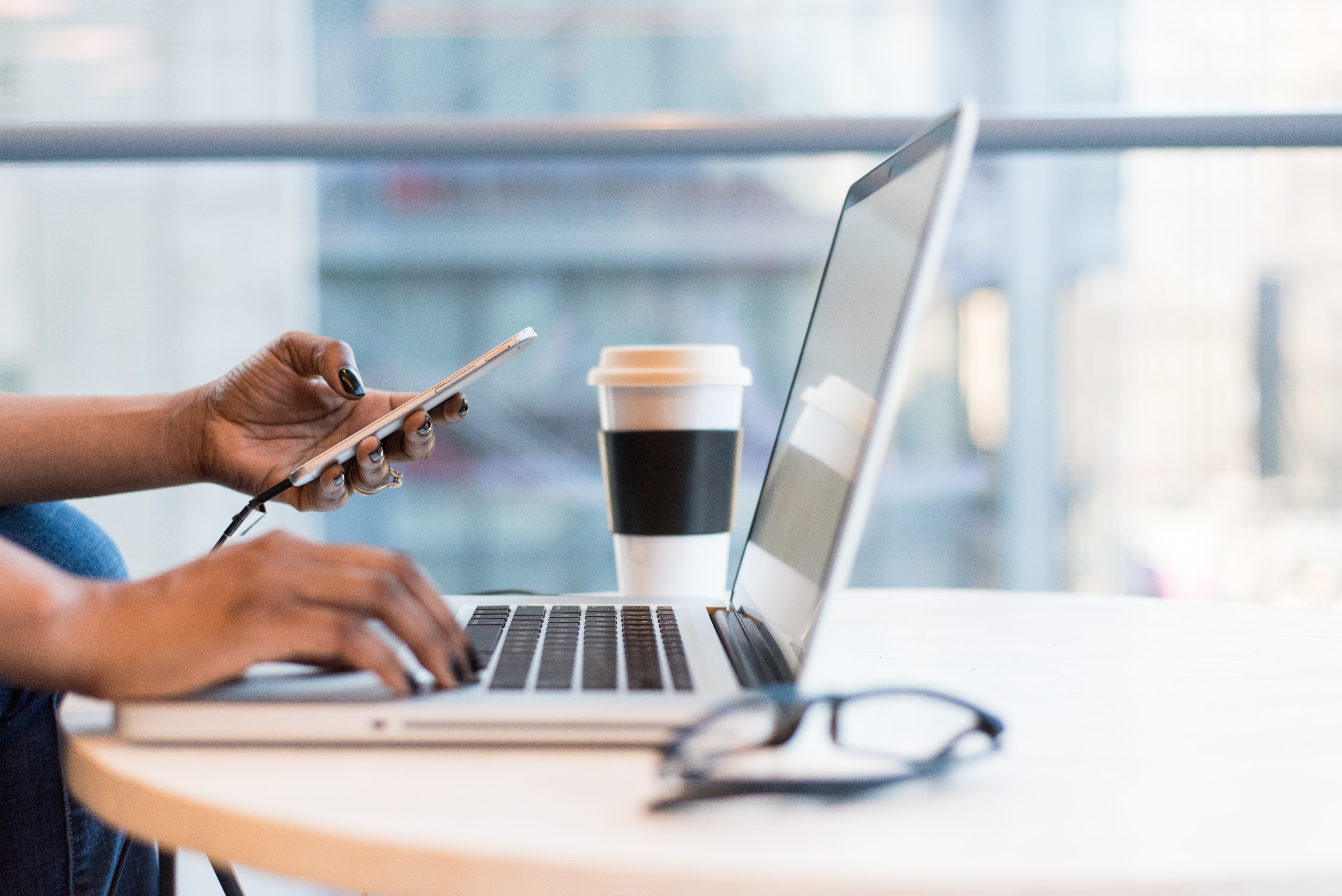 lady's hands in front of laptop