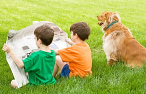 Boys reading newspaper