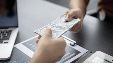 Two people exchanging money