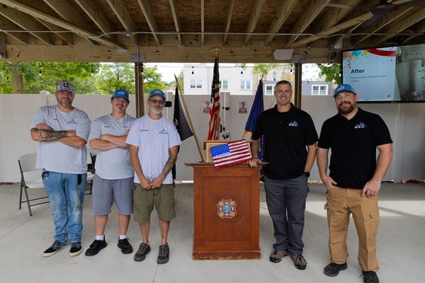 Contractors posing for photo during groundbreaking event.