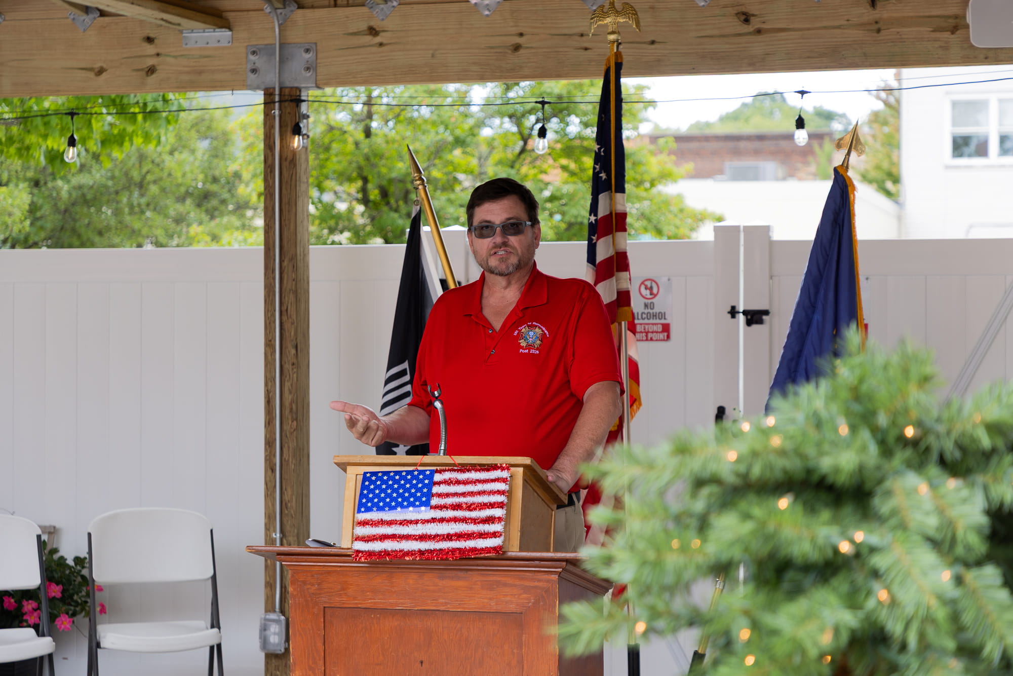 Veteran speaking at a podium.