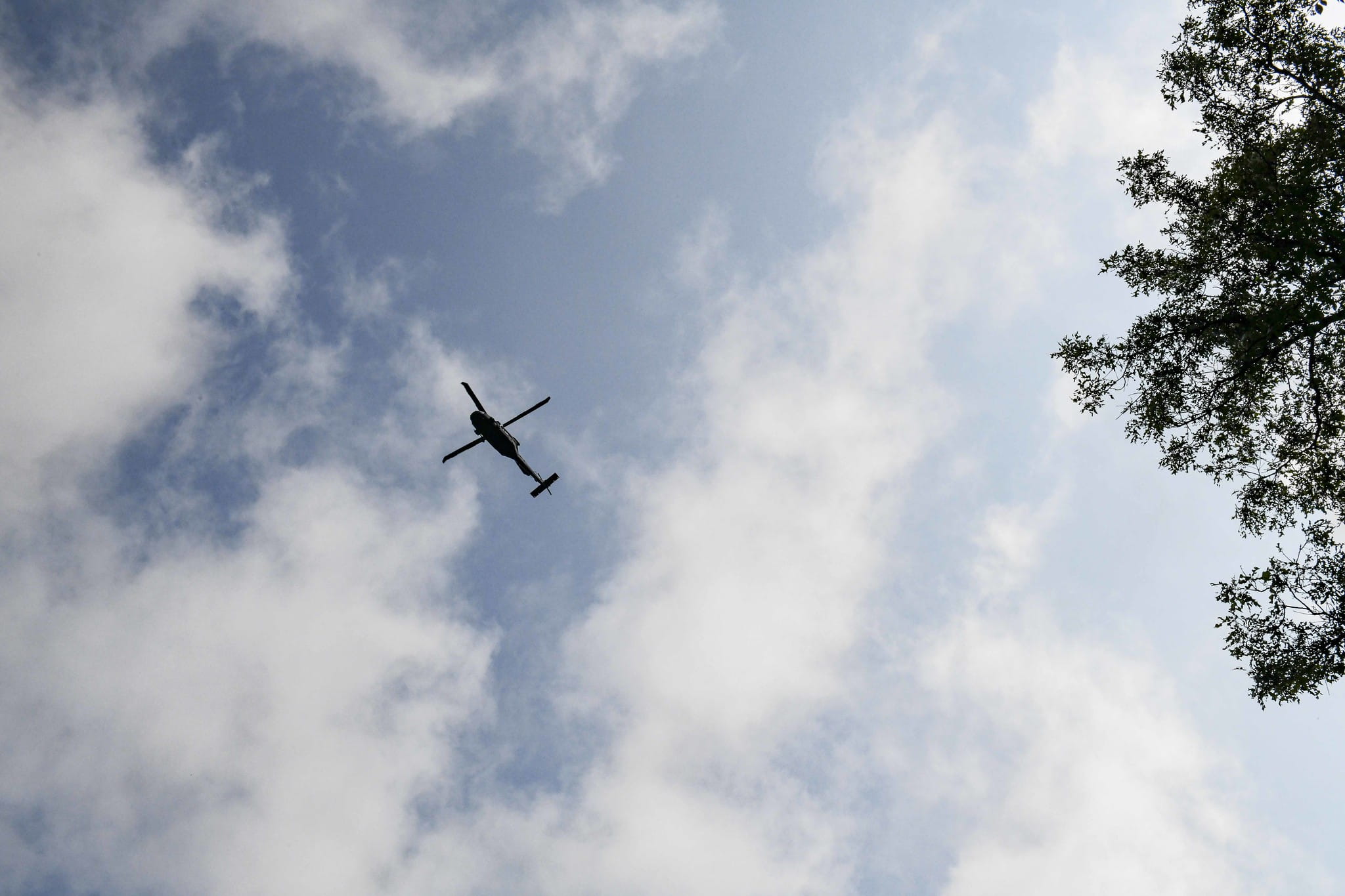 a helicopter flies overhead
