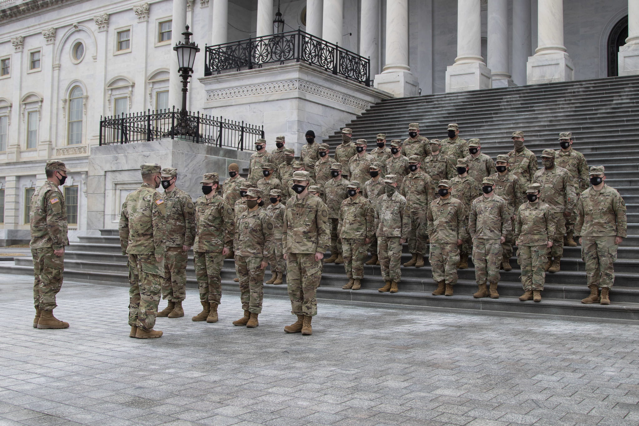 Michigan National Guard service members standing at attention on the steps of the U.S. Capitol