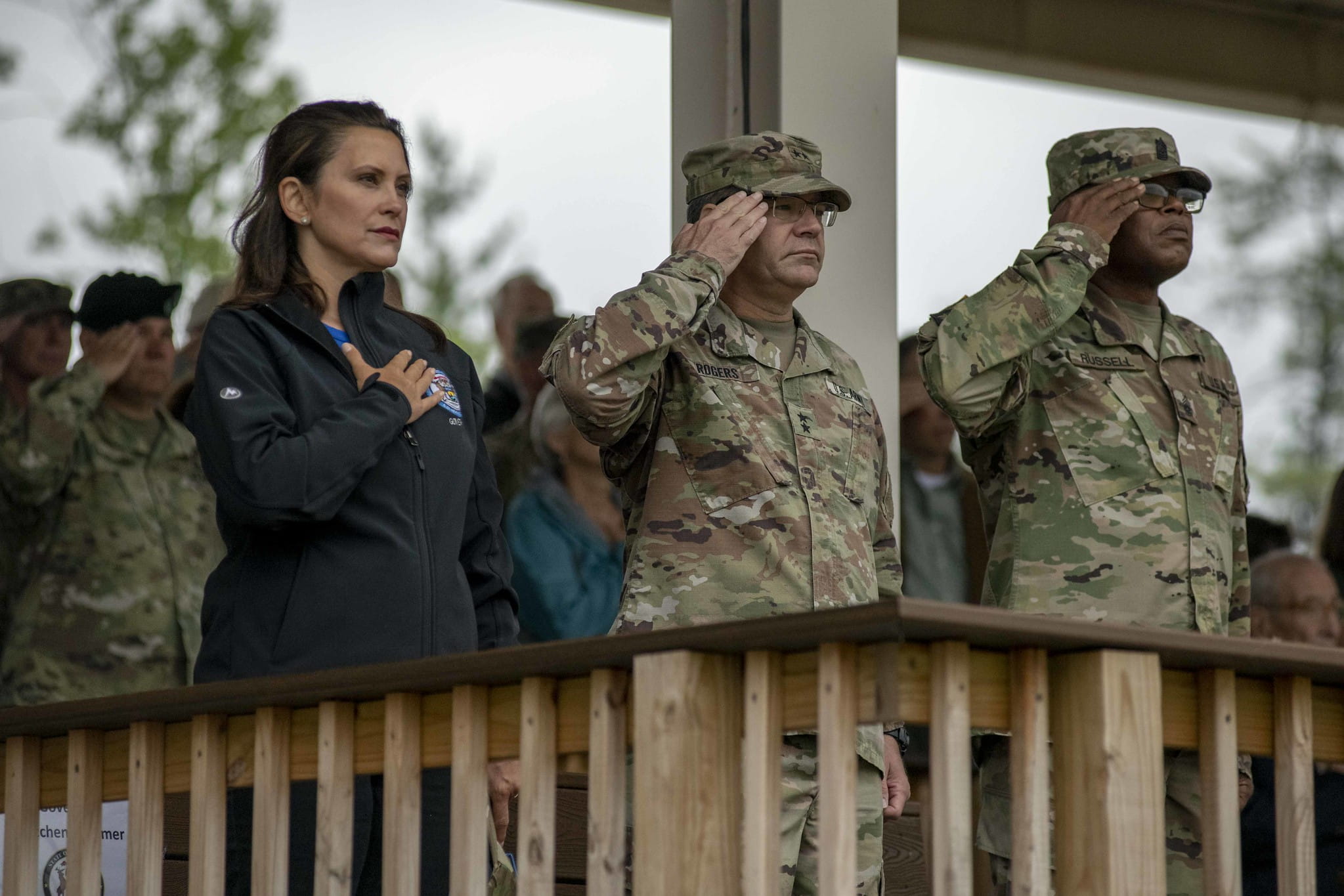 Governor Whitmer, TAG Paul Rogers and CSM Russell Saluting Soldiers during Pass and Review
